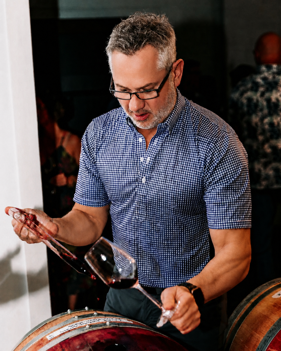 Jon-Michial Carter drawing wine from a barrel