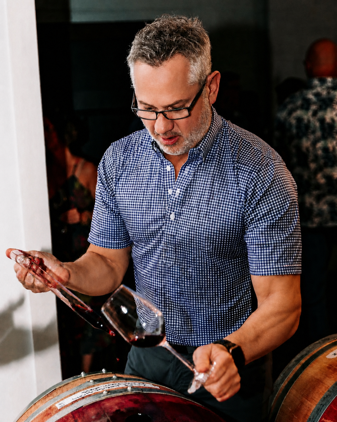Jon-Michial Carter drawing wine from a barrel