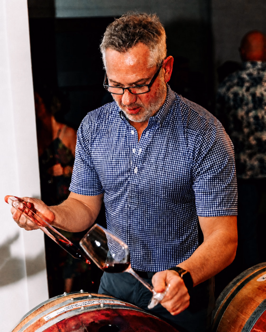 Jon-Michial Carter drawing wine from a barrel